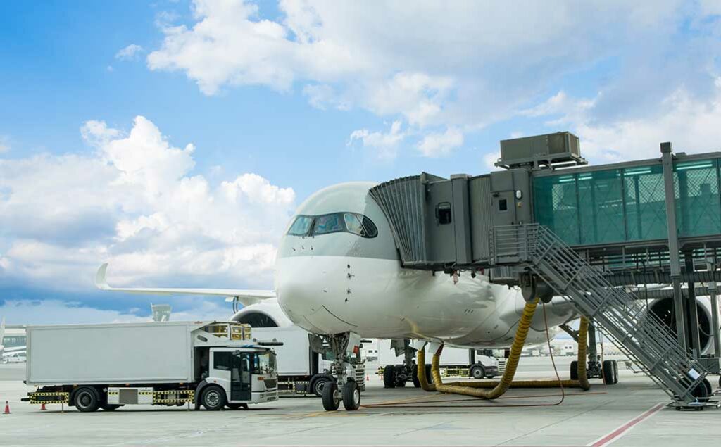 passenger plane getting refills before takeoff