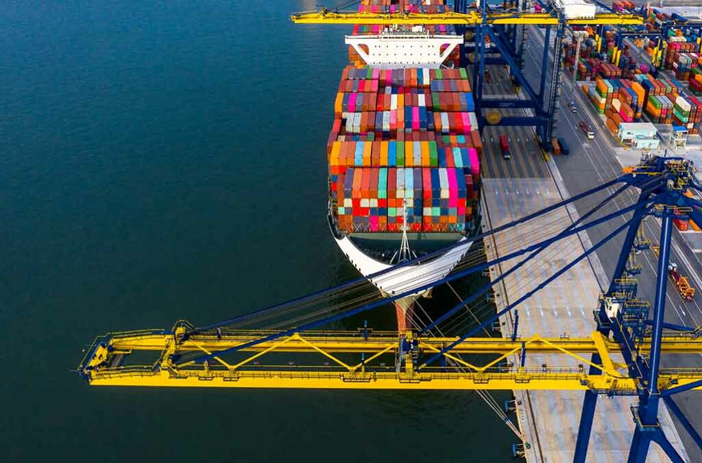 aerial view of a cargo ship docked on a port