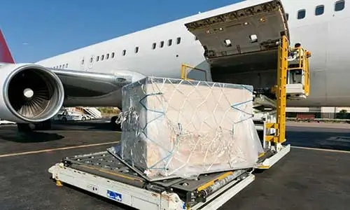 cargo box being loaded on a freight plane