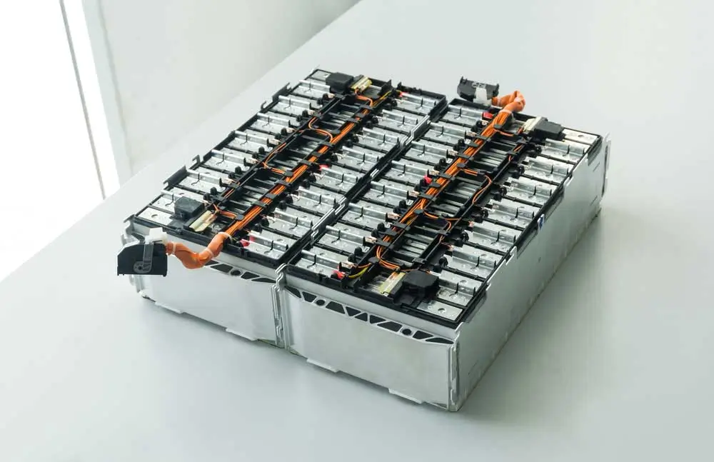 two large batteries on a white desk